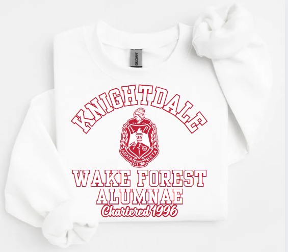 A collection of unisex sweatshirts in black, white,  and red colors, featuring the text 'Knightdale Wake Forest Alumnae' and the logo of Delta Sigma Theta Sorority, Inc.