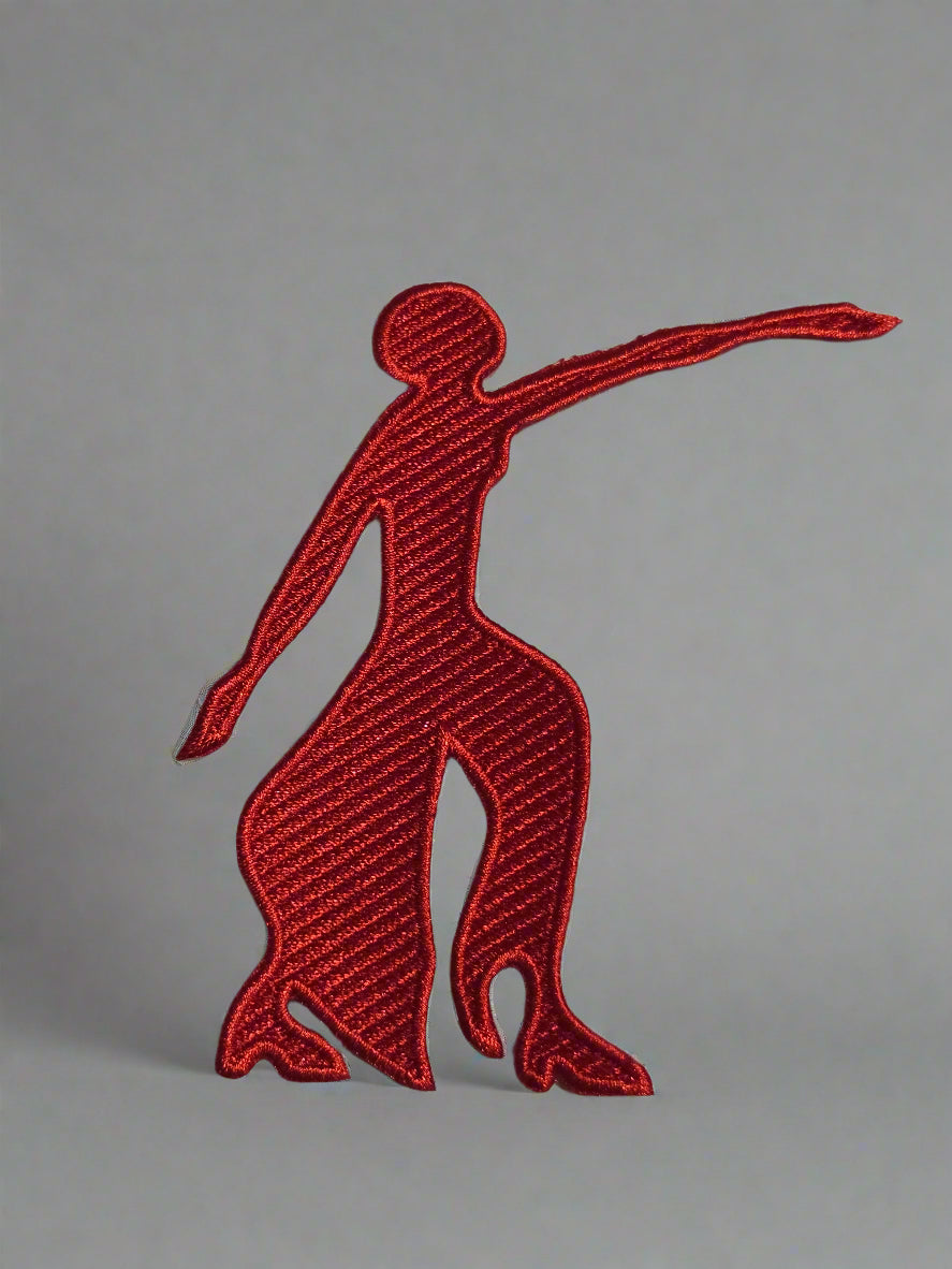 Red embroidered logo of a leaping dog on a beige background