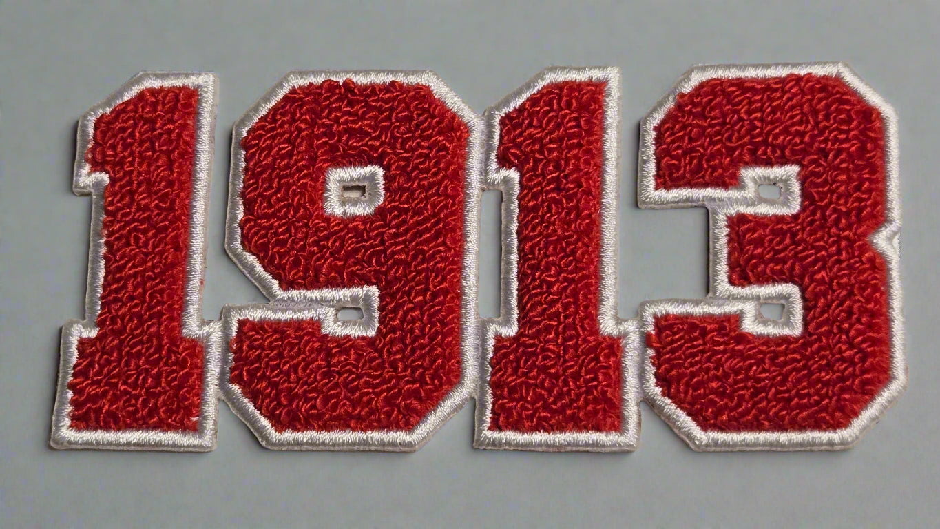 Red embroidered patch with a design on a beige background
