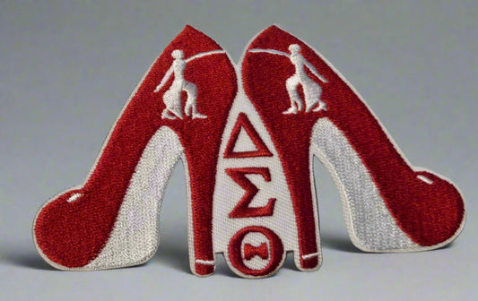 Patch of red high-heeled shoes with a symbol on a beige background