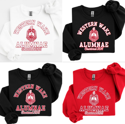 A collection of four sweatshirts in black, white, and red colors with the text 'Western Wake Alumnae' and a graphic emblem on the front.