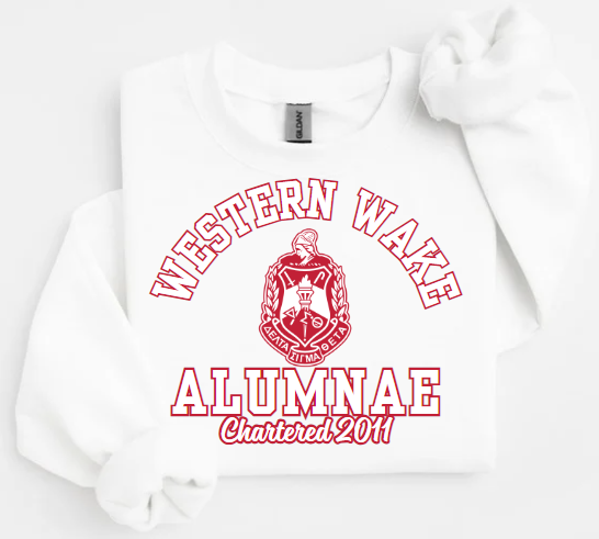 A collection of four sweatshirts in black, white, and red colors with the text 'Western Wake Alumnae' and a graphic emblem on the front.